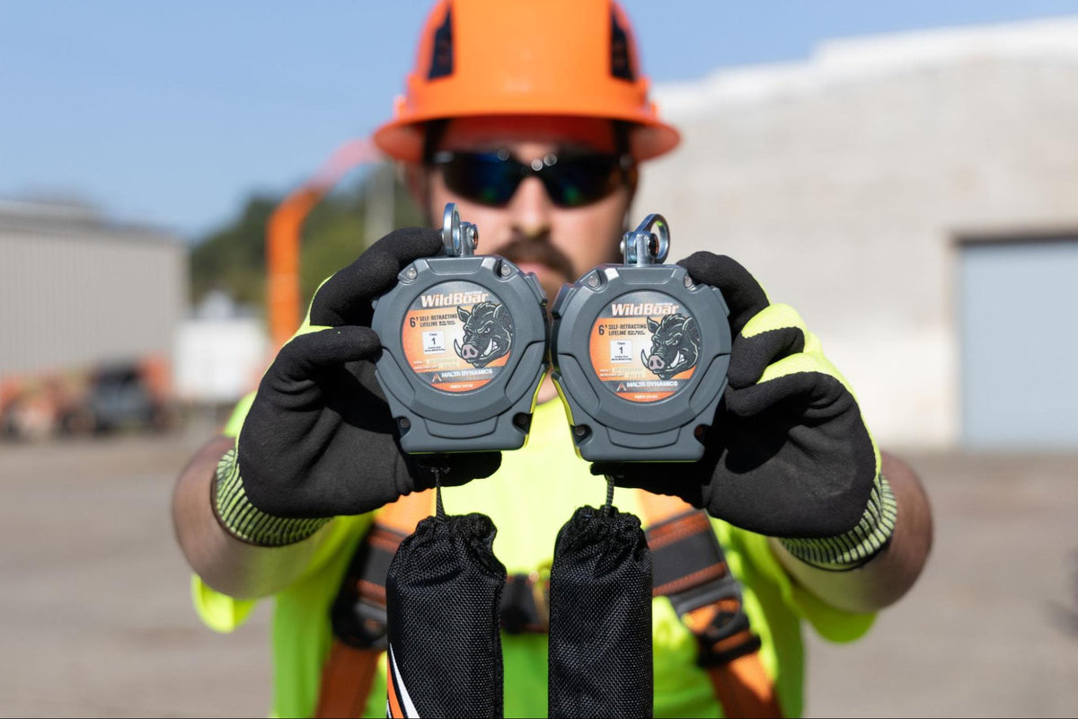 Construction worker holding up two SRLs