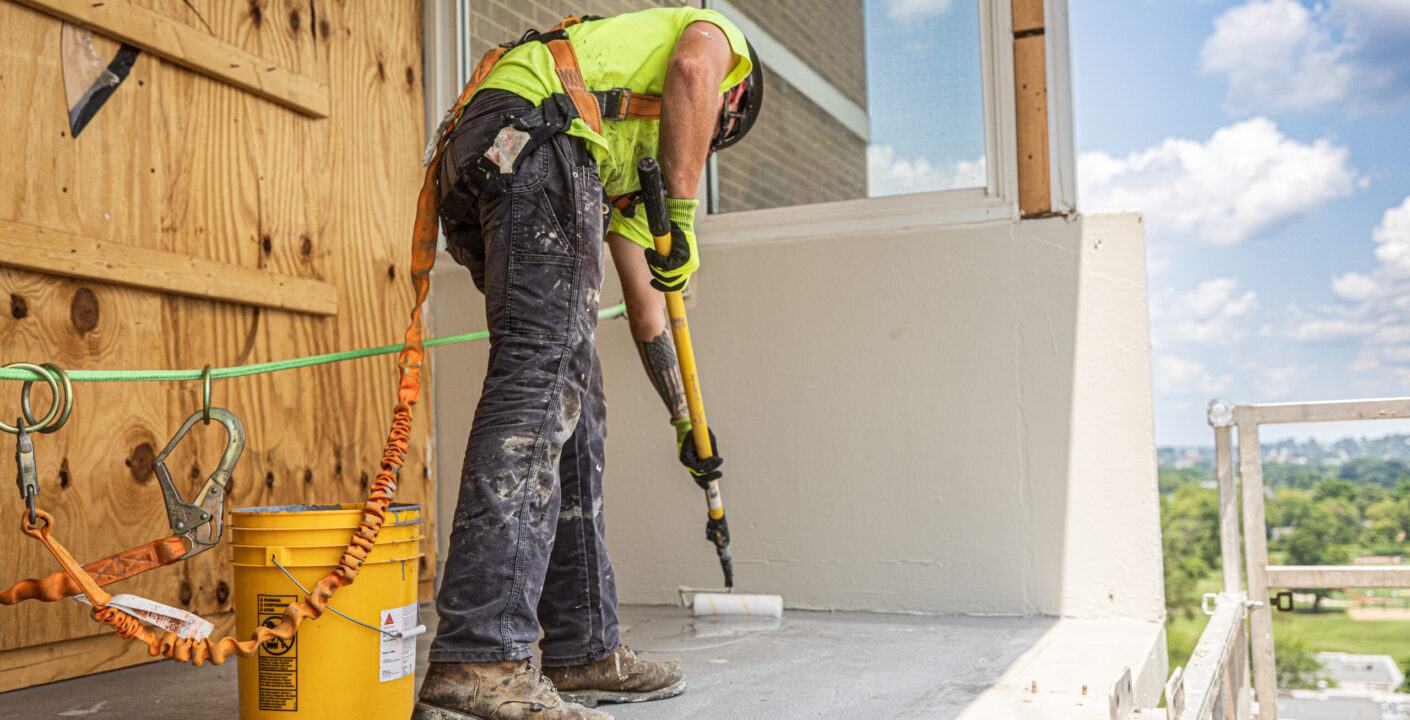 Man working on construction site wearing Malta Dynamics PPE.
